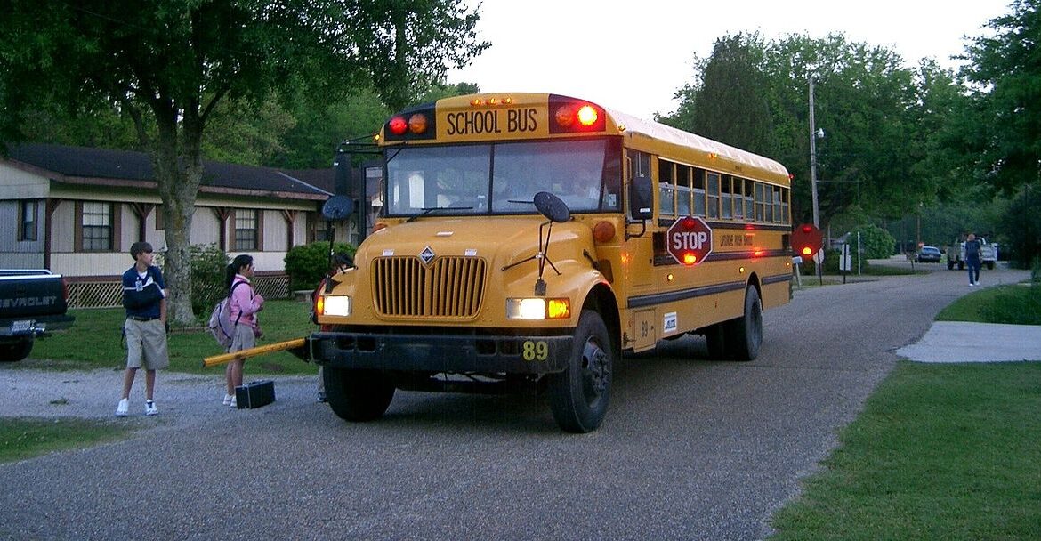 Children getting on school bus